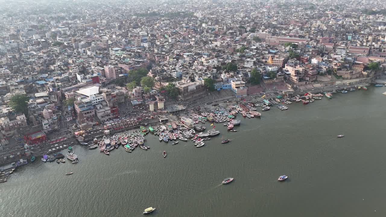 Aerial perspective of the Ganges River as it winds through the heart of Varanasi, where the sacred and the mundane blend seamlessly.