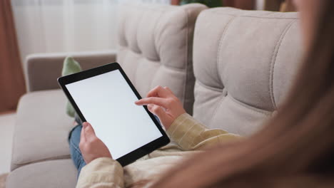 back view of a girl using a tablet