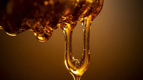 the mesmerizing flow of amber liquid: captured moments of viscous dripping honey under soft lighting