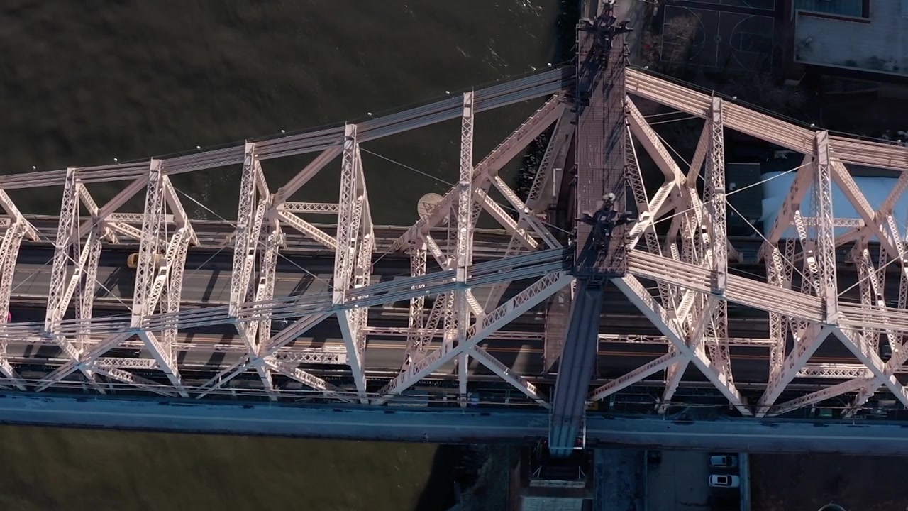 View of cars moving on a bridge in New York City from above