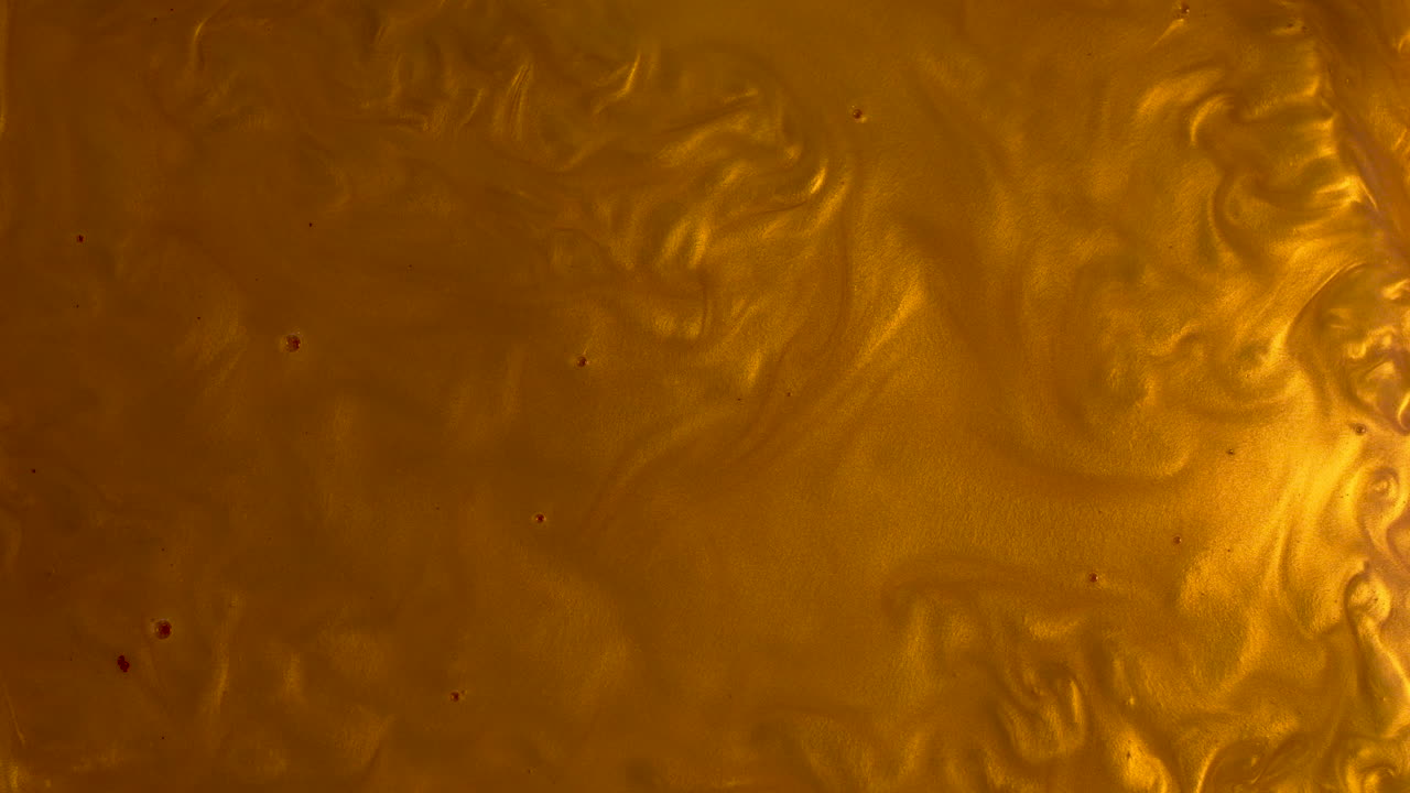 Liquid gold with small waves
