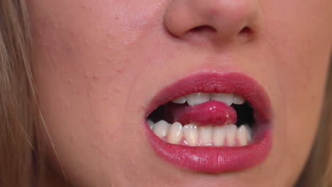 sexy girl with red lips playing with her tongue,close up shot