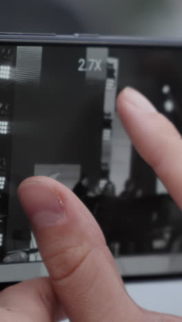 Smartphone Display Showing 3x Zoom Photo of a Concert