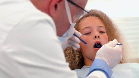 dentist examining a patients teeth