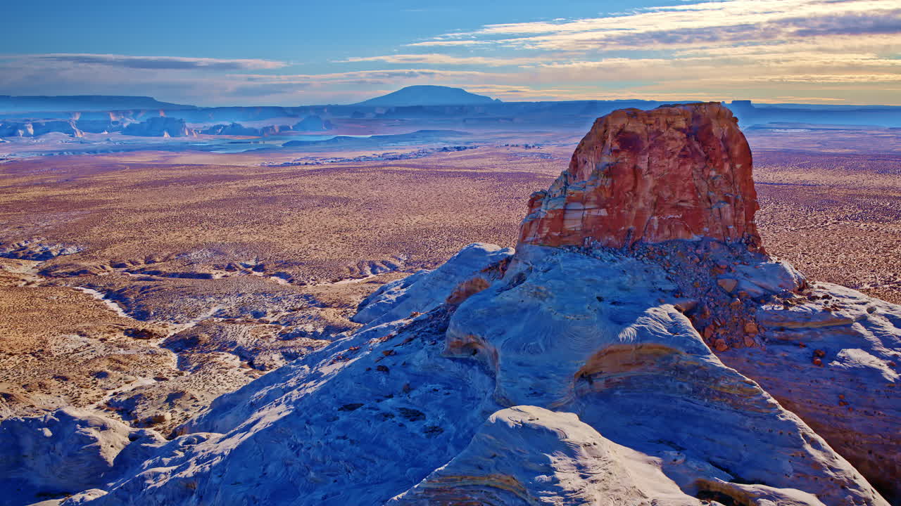 A drone elegantly moves through the sky, highlighting the rugged splendor of red rock formations and deep gorges.