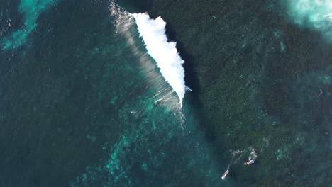 Aerial-top-view-showing-professional-surfer-surfing-on-giant-waves-of-Ocean-during-sunny-day-in-Australia---Surf-Margaret-River-PRO-2023