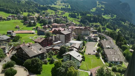 Aerial-rise-and-back-away-over-Wengen,-Switzerland