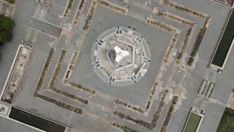 aerial footage above the win win memorial monument, phnom penh, cambodia. camera top down spin above the monument from right to left