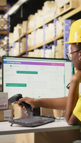 vertical video black worker applying and scanning barcodes awb tags on cargo boxes