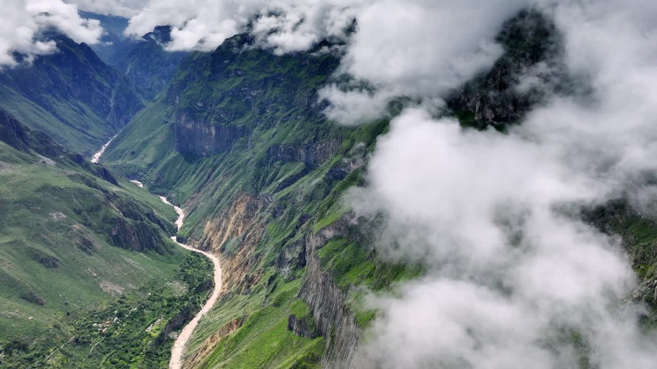 Drone shot moving forward through the Colca Valley, capturing the breathtaking landscape as the valley unfolds in the distance.