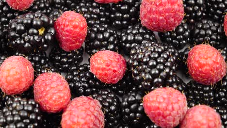 ripe raw berries of raspberry and blackberry, background