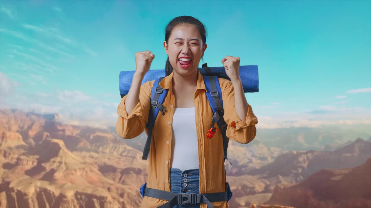 Asian Female Hiker With Mountaineering Backpack Screaming Goal Celebrating The Success While Traveling At The Top Of Mountain
