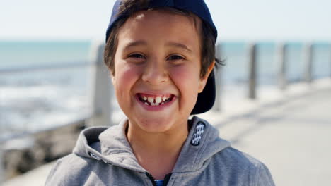 boy, smile and happy portrait on beach for summer