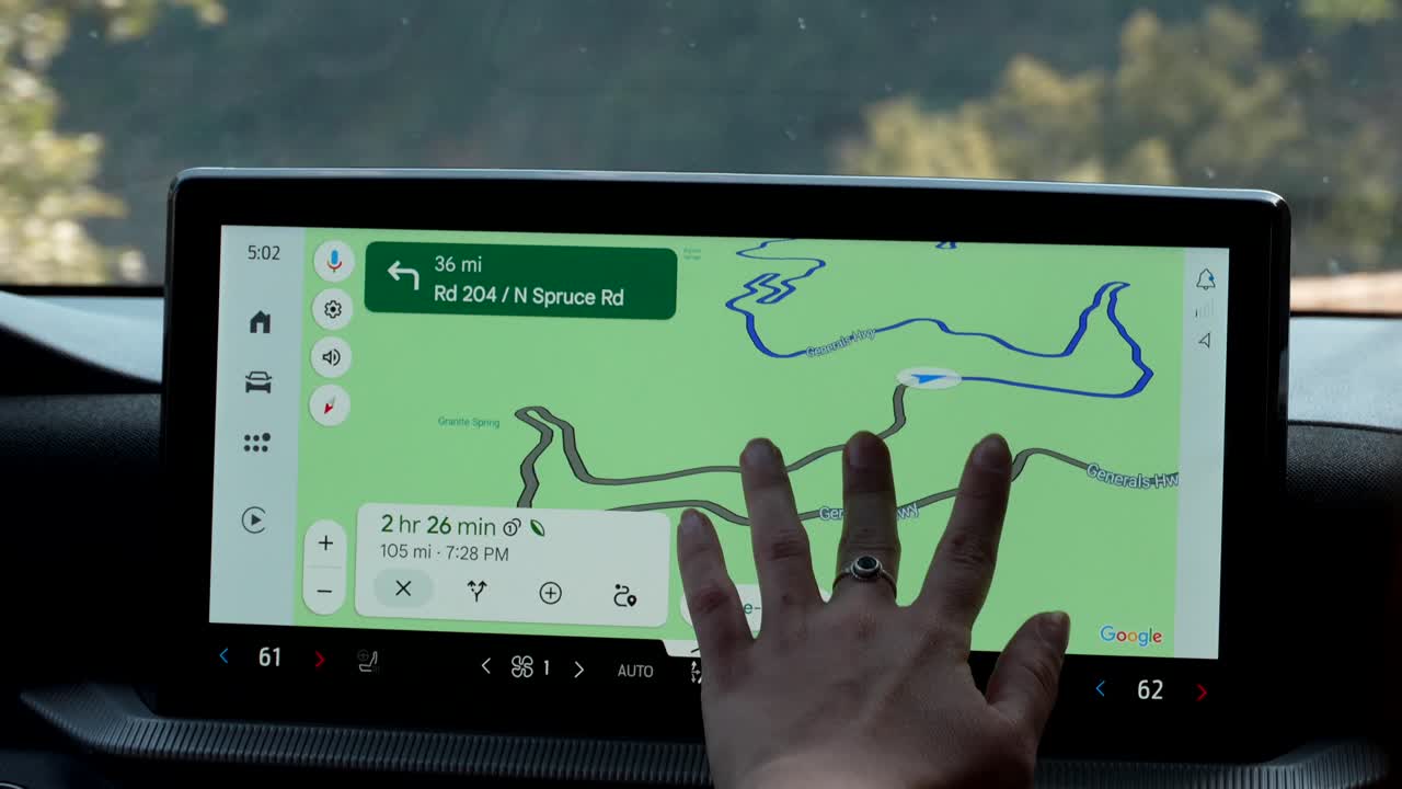 Hand Interacting with Car Navigation Map on Infotainment Screen
