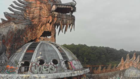 Abandoned-Waterpark-Hue-Vietnam-with-big-dragon,-aerial