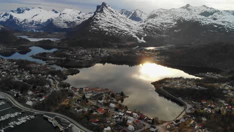 sunshine reflection in a beautiful lake with a mountainous background