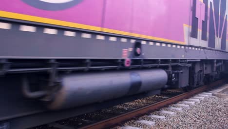 Static-view-of-air-conditioned-amtrak-mbta-passenger-train-running-on-track