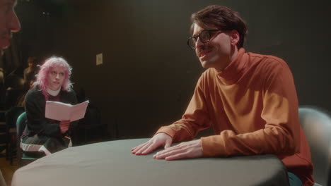 talented actor performing on stage on rehearsal with female dramaturg