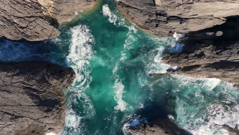 top view of rugged shores of mera beach in a coruna, galicia, spain. aerial shot