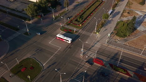 aerial view of a city intersection with buses and cars