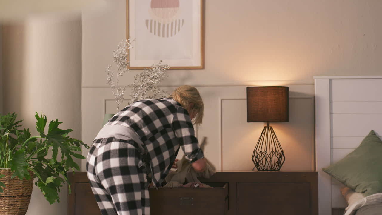 Bedroom scene with woman and decor