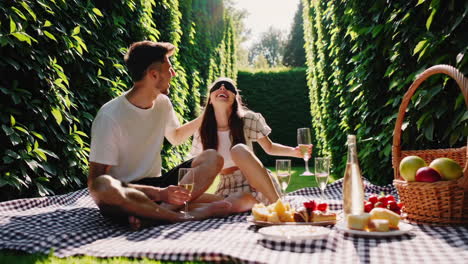 couple enjoying a picnic in a garden maze