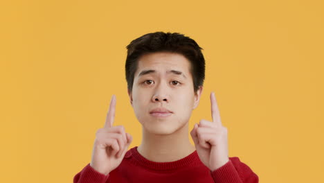 man pointing upward