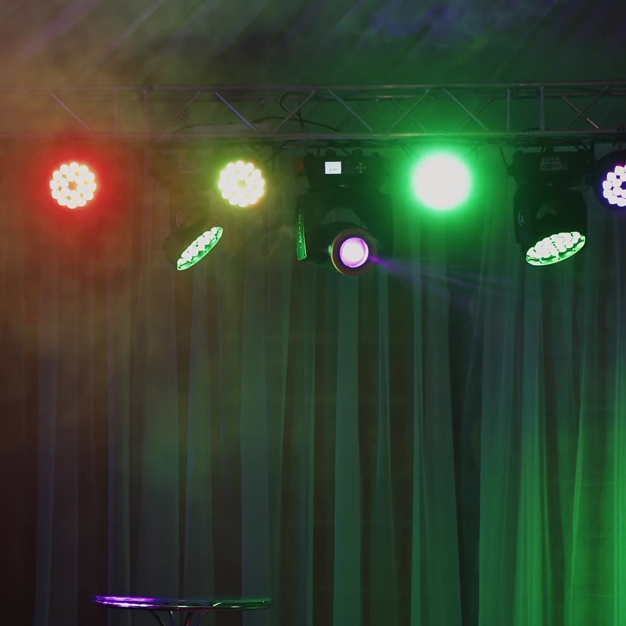 Spotlights and lighting equipment for the nightclub. Multi-colored lights shimmering from ceiling.