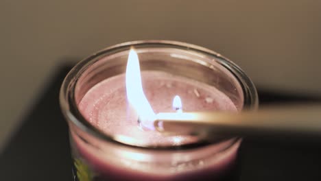 lighting a candle with two wicks two fires one candle