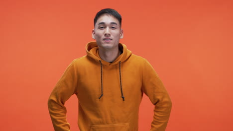 man in orange hoodie