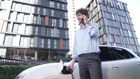 suit-clad businessman with progressive ambition leaning on his electric vehicle.