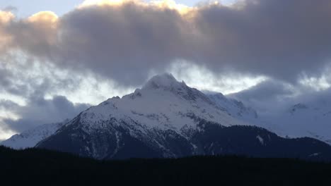 Snowcapped-Mountain-Peaks-Under-Clouded-Sky.-Wide-Shot