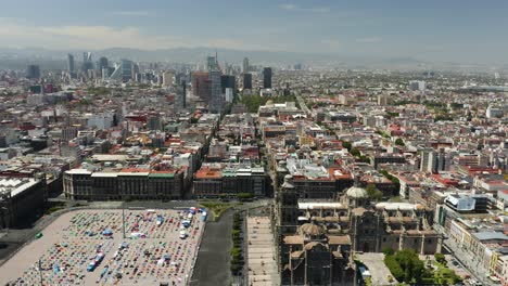 zocalo in mexico city, birds eye view, skyscrapers in background, truck right