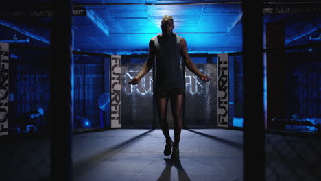 man jumping rope in a boxing gym