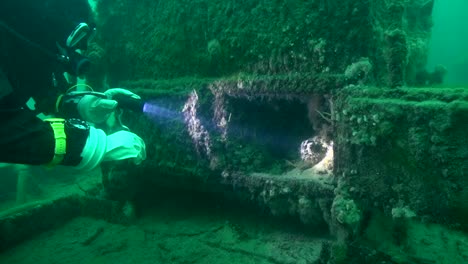 scuba diver explores the boiler firebox on goldrush paddlwheel aj goddard