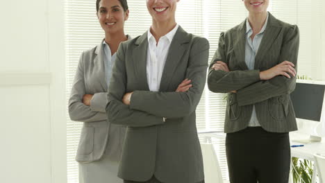 Business-people-looking-at-camera-with-arms-crossed