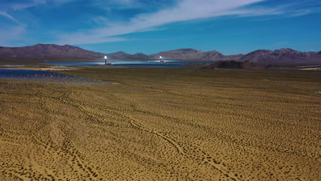 aerial view of production of concentrated solar power using heliostat arrays and thermal towers