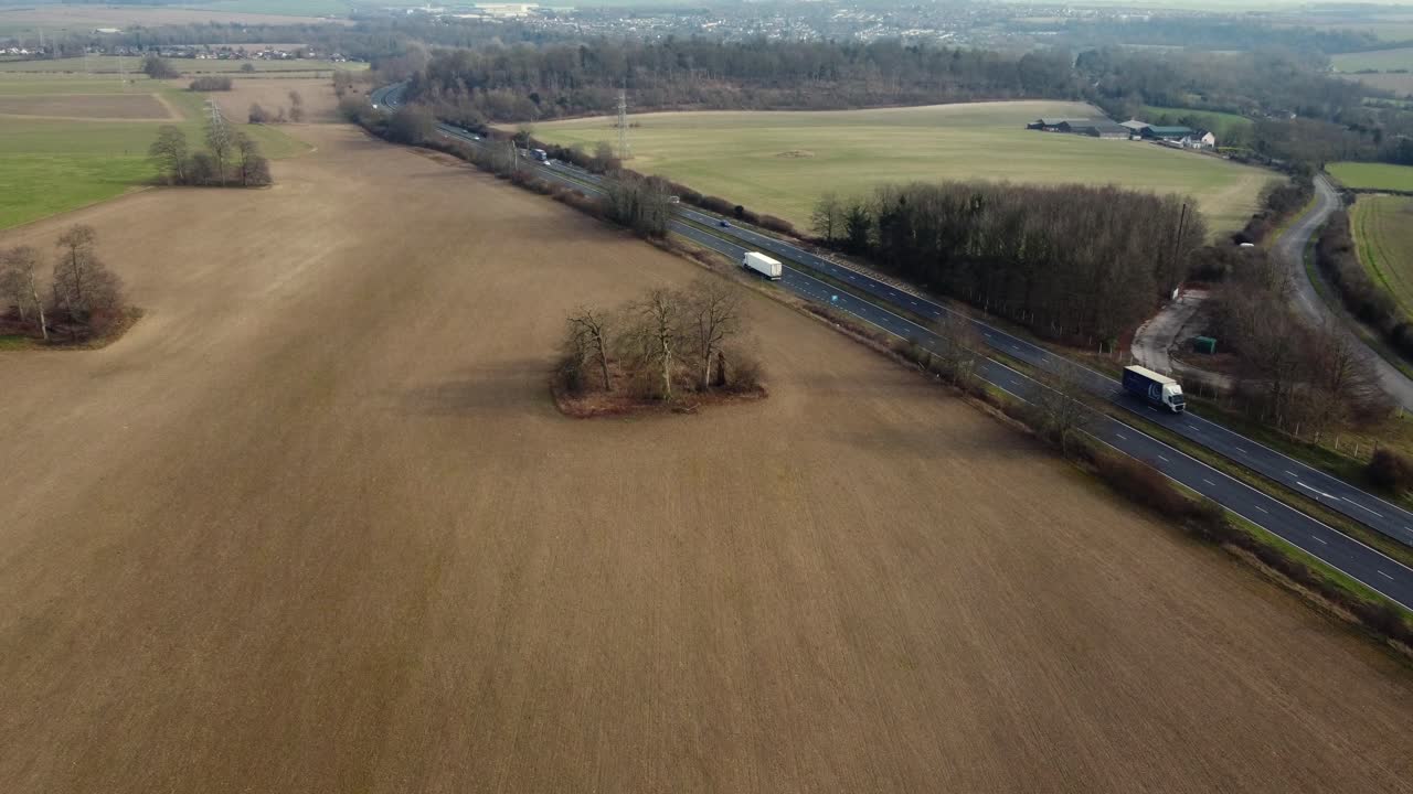 Aerial view of a highway and surrounding fields
