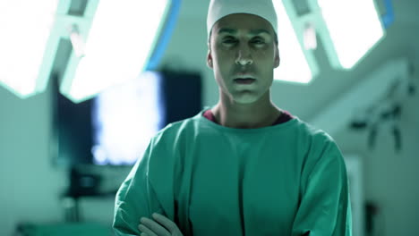 portrait of caucasian male surgeon wearing surgical gown in operating theatre, slow motion