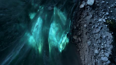 top view close up of transparent blue ice cave glacier in ice cave in iceland,europe ice cave glacier