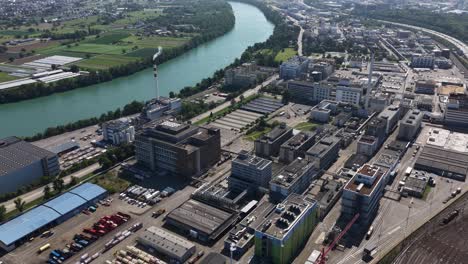 pharmaceutical industrial production site in pratteln, switzerland, focusing on industrial area, pharma industry, and manufacturing infrastructure. aerial video