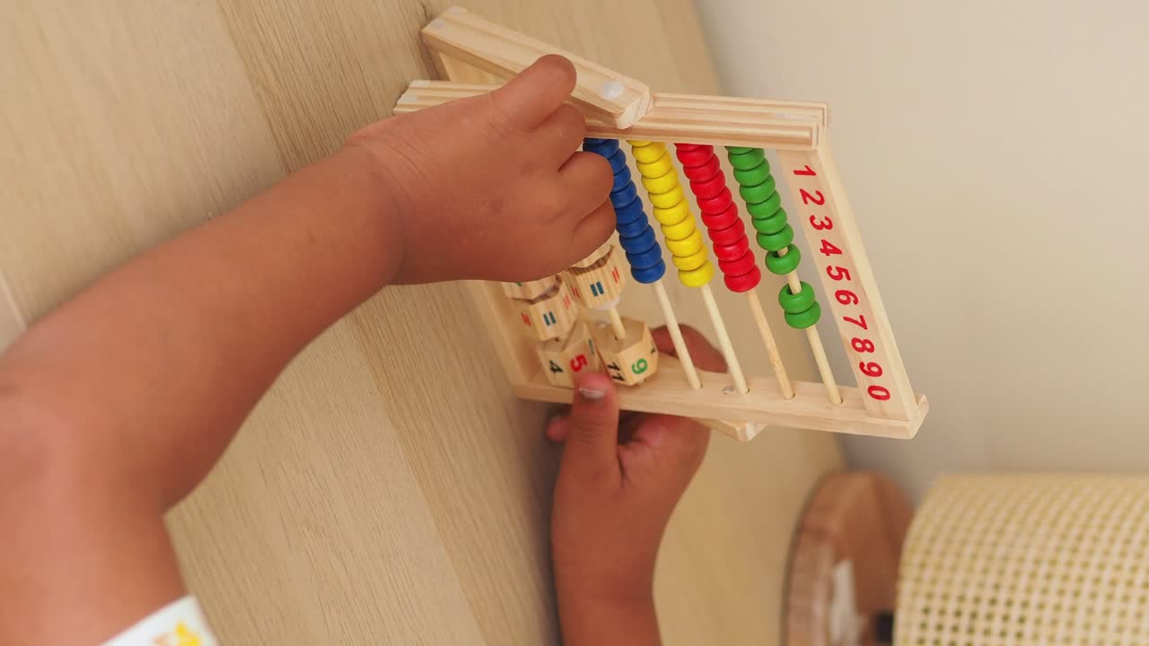 Child playing with an abacus