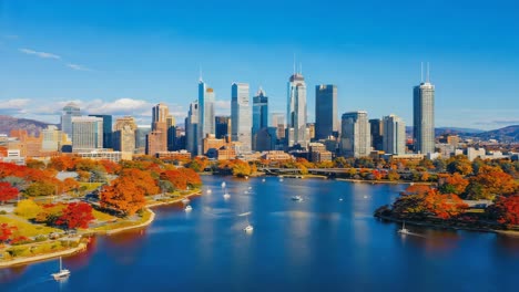 autumn cityscape with river and boats