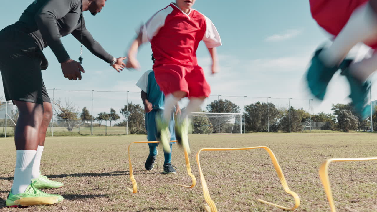 Kids training agility with soccer coach