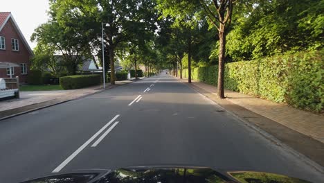 pov driving in a suburban neighborhood in odense, denmark