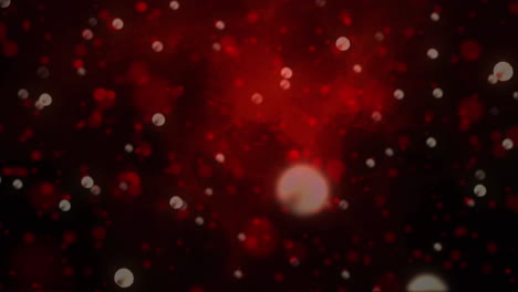 manchas brillantes de luz que se mueven contra un fondo rojo