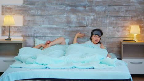 married couple waking up in the morning