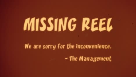 intertitle projected onto an aged theater screen the management