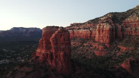 Panning-aerial-drone-shot-of-Red-rocky-mountains-and-hills