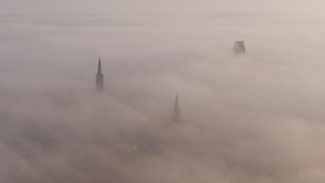 aerial view of elfsteden stad bolsward with dense fog during sunrise